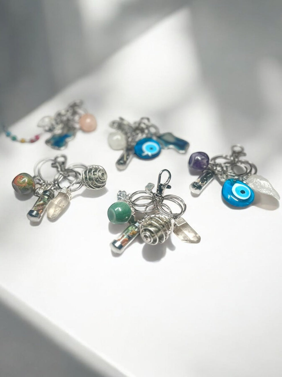 Grounding & Abundance Crystal Keychain Set – Pyrite Spiral, Smoky Quartz Point, Unakite Apple, Mini Gem Jar & Lucky Charms