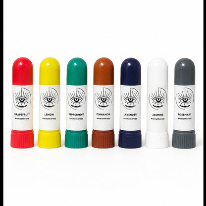 JoyfulBliss Co. set of seven colorful aromatherapy inhalers with essential oil labels on a white background.