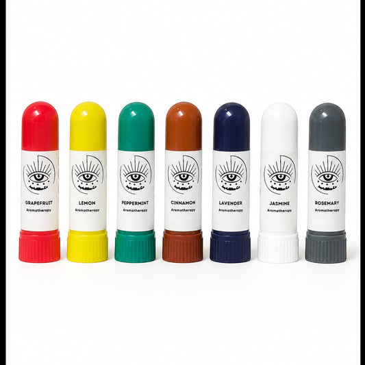JoyfulBliss Co. set of seven colorful aromatherapy inhalers with essential oil labels on a white background.