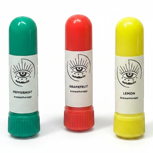 JoyfulBliss Co. aromatherapy inhaler trio in green peppermint, red grapefruit, and yellow lemon scents.
