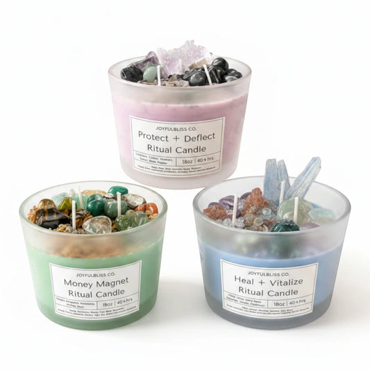 JoyfulBliss Co. set of three 18oz soy wax ritual candles in frosted glass with crystal, herb, and botanical toppings.