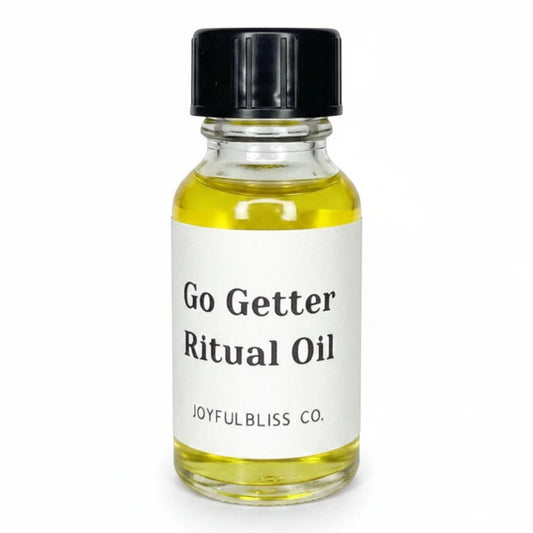 JoyfulBliss Co. Go Getter ritual anointing oil in a 10ml clear glass bottle with a black cap and yellow liquid.