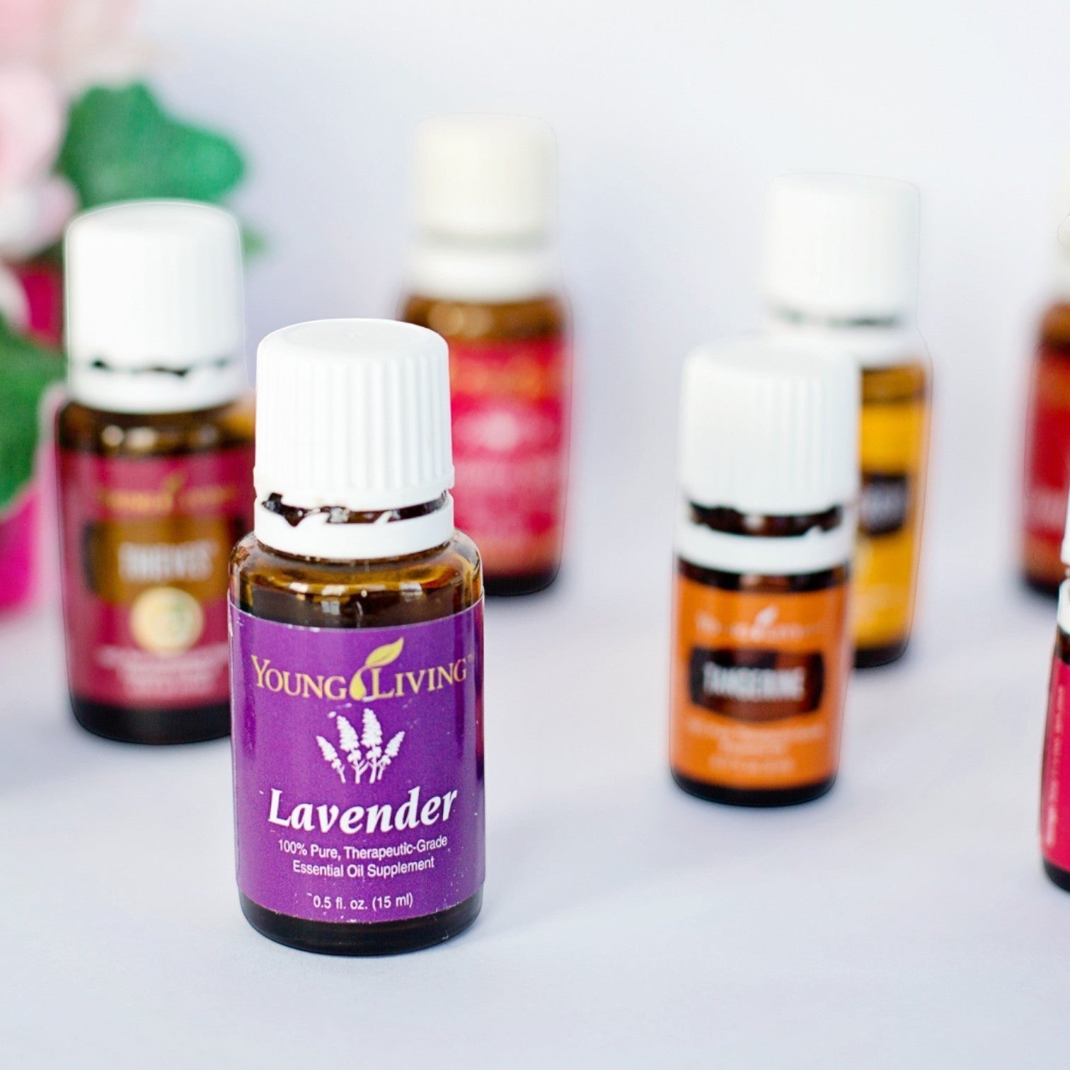 JoyfulBliss Co. 15ml amber glass essential oil bottle with purple Lavender label on a white surface