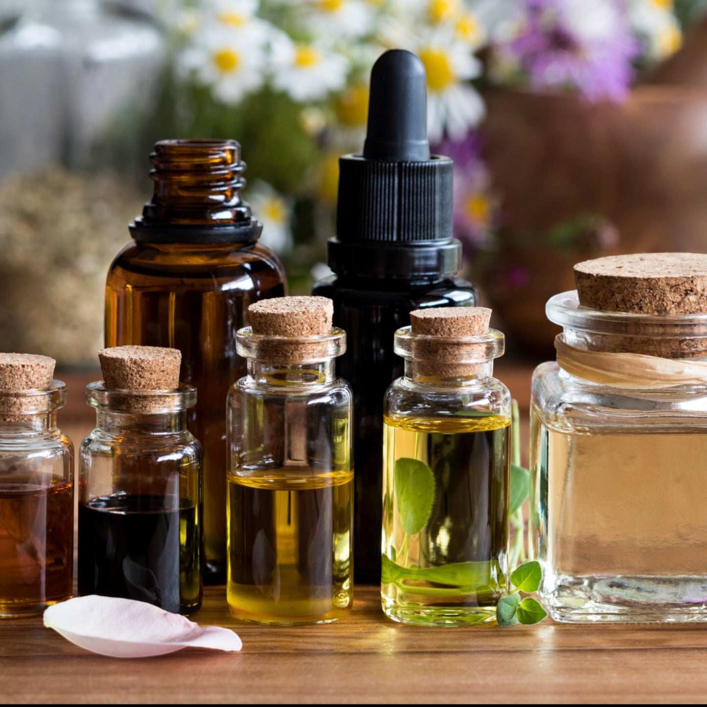 JoyfulBliss Co. Love Potion ritual anointing oil in a 10ml glass bottle with a cork stopper for attraction spells.