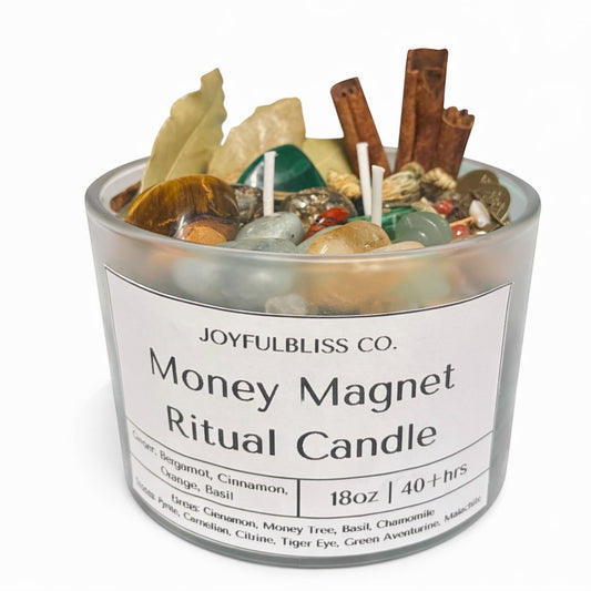 JoyfulBliss Co. Money Magnet ritual candle in a frosted glass jar with crystals, cinnamon sticks, and botanicals.