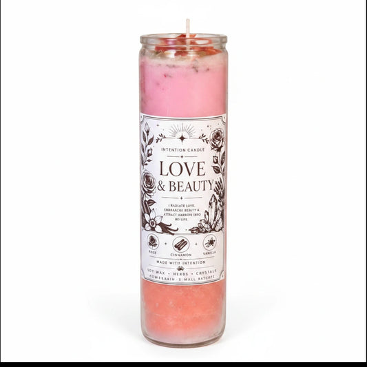 JoyfulBliss Co. pink soy wax intention candle in a glass jar with rose, cinnamon, vanilla, herbs, and crystals.