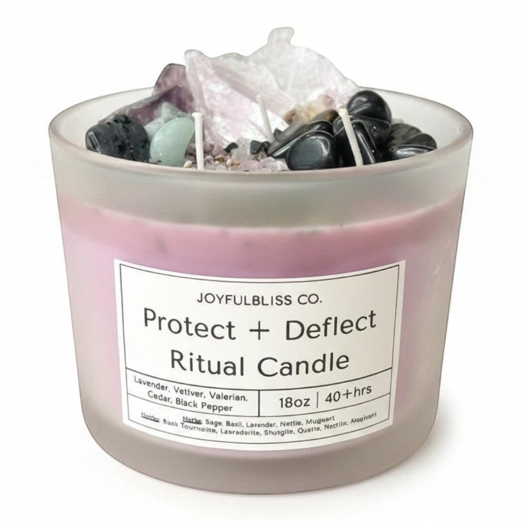 JoyfulBliss Co. Protect & Deflect ritual candle in a frosted glass jar topped with amethyst and obsidian crystals.