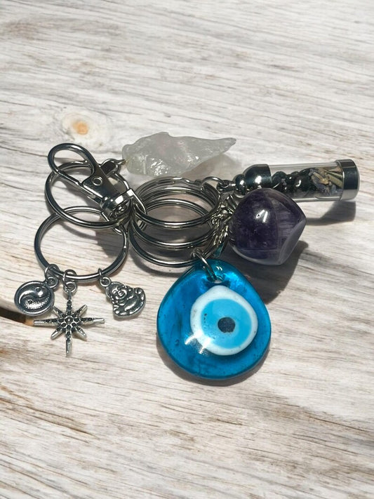 Spiritual Protection & Peace Crystal Keychain Set – Evil Eye, Amethyst Apple, Clear Quartz Arrowhead, Yin Yang, Buddha & Mini Spell Jar